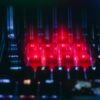 Close-up of a glowing keyboard with red and blue lights.