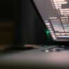 Laptop screen displaying lines of code